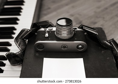 Artwork in retro style, old camera, film, piano - Powered by Shutterstock