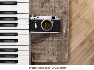 Artwork in retro style, old camera,  piano - Powered by Shutterstock