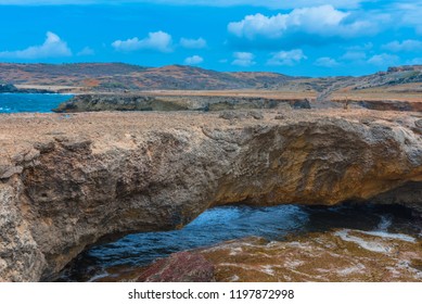 The Aruba Natural Bridge Was Formed Over Hundreds Of Years Of As The Sea Carved Its Way Through Coral Rock. It Collapsed In 2005; This Photo Is The 