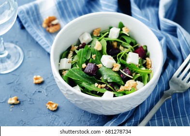 Arugula Beet Goat Cheese Walnuts Salad. Toning. Selective Focus