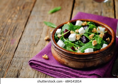 Arugula Beet Goat Cheese Walnuts Salad. Toning. Selective Focus