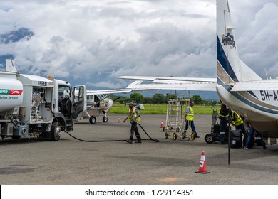 Arusha, Tanzania - December 28, 2019 : Fuel Truck Refueling Small Propeller Airplane Before Takeoff At Arusha Airport, Tanzania, East Africa