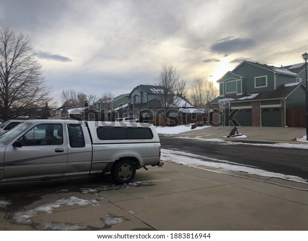 Arvada,\
Colorado, United States, December, 18, 2020: View of a typical\
American neighborhood with its basketball net in Arcada on the\
outskirts of Dever, Colorado, United\
States