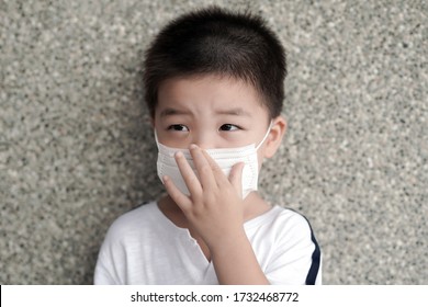 Asain Kid Wearing Face Mask. 