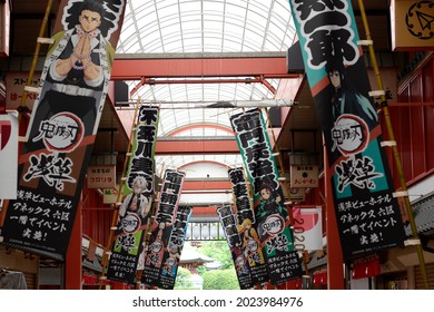 Asakusa, Tokyo, Japan - July 25 2021: Demon Slayer: Kimetsu No Yaiba banners in a shopping alley in Asakusa.