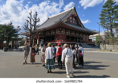 Asakusa, Tokyo/Japan - March 11, 2020: A Sightseeing Group Tour By TOTO MOTORS CO.LTD At Sensoji Temple During The Breakout Of The Coronavirus (COVID-19). Tour Groups Are Rarely Seen.