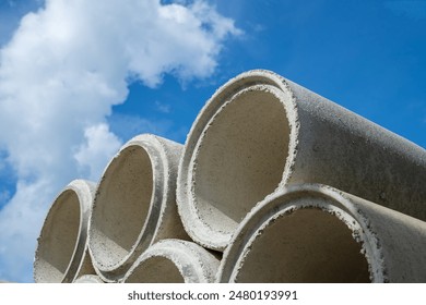 Asbestos cement pipes stacked on a construction site - Powered by Shutterstock