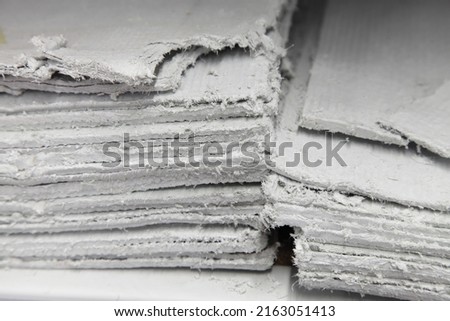 Asbestos sheets in stack - effective insulator for construction