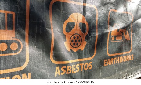 Asbestos warning signtage at construction site. Asbestos has to be inhaled to be hazardous to human health, it is a one of the big health concern.