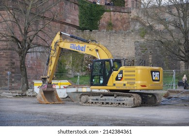 Aschaffenburg,Germany-April 03,2022 : Medium Excavators Caterpillar 320 Parked At The Site,belongs To An American Fortune 100 Corporation Caterpillar Inc.Founded In April 15, 1925