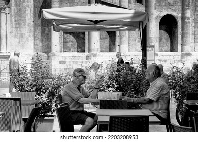 Ascoli Piceno, Italy - August 23 2022: Two Old Men Talking In People Square