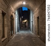 Ascoli Piceno (Marches, Italy): a very narrow alley at evening