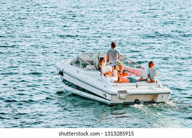 Ascona, Switzerland - August 23, 2016: Family In Boat In Ascona Luxury Tourist Resort On Lake Maggiore, Ticino Canton In Switzerland In Summer. Outdoor Travel. Swiss Holiday Vacation Sailing In Ship