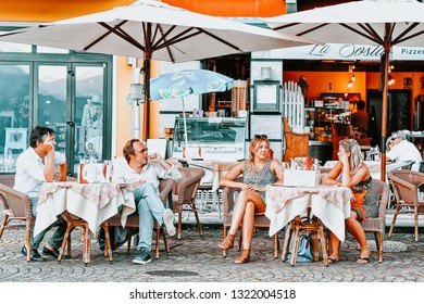 Ascona, Switzerland - August 23, 2016: People In Street Cafe In Romantic Luxury Resort In Ascona Town On Lake Maggiore, Ticino Canton In Switzerland. Outdoor Expensive Family Restaurants In Swiss City