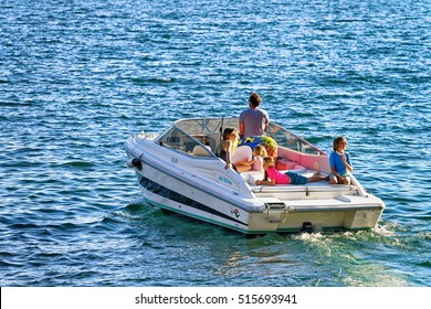Ascona, Switzerland - August 23, 2016: People sailing in the boat at the luxurious resort in Ascona on Lake Maggiore in Ticino canton in Switzerland.