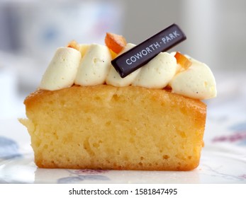 Ascot, UK - September 2019 – Side View Of An Isolated Lemon Drizzle Cake With Elderflower Cream From A Michelin Starred Afternoon Tea In Berkshire       