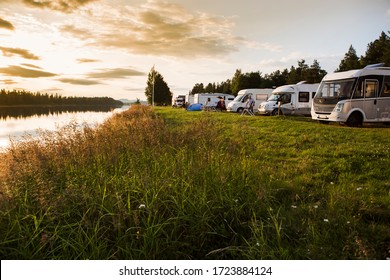 Asele / Sweden - juli 24 2017: Motorhomes at a Campsite in Sweden, parked with a view over the river. The river is Angermanalven and the campsite is in the village of Asele.