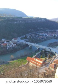 Asenovo District, Veliko Tarnovo, Bulgaria - February 2018: Panoramic View Of Trapezitsa Hill And Yantra Valley With The Arched Bridge And Road 514 Running On It