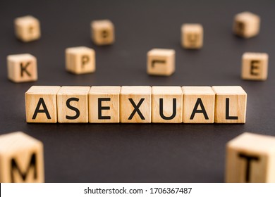 Asexual - word from wooden blocks with letters, without sex or sexuality asexual concept, random letters around white background