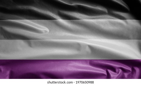 Asexuality flag waving in the wind. Close up of asexual banner blowing, soft and smooth silk. Cloth fabric texture ensign background. Use it for pride gay day and events concept.