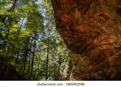 Ash Cave at Hocking Hills State Park in Ohio. Unique split view of woods and cave wall.