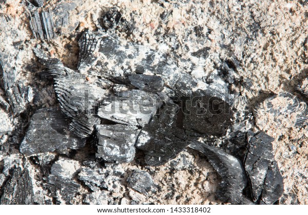 Ash in close-up with\
pieces of coal