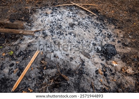 ash from the remains of a firecamp extinguished
