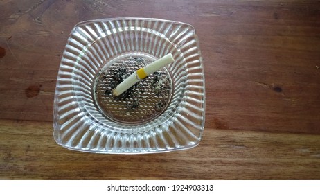 Ash Tray Made From Glass With Wooden Background