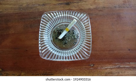 Ash Tray Made From Glass With Wooden Background