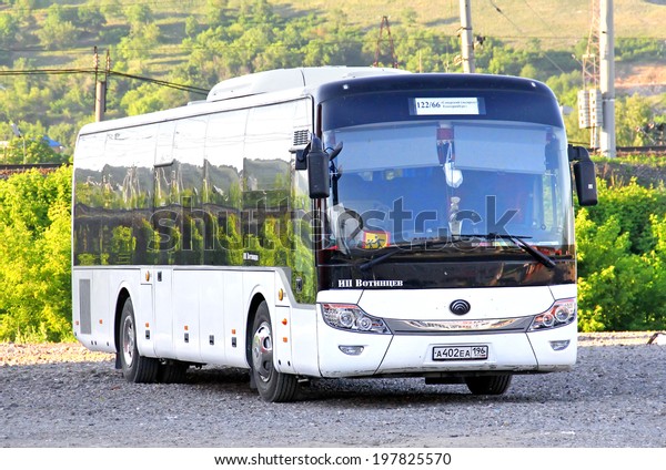 ASHA, RUSSIA - JUNE 2, 2014: White Yutong\
ZK6121HQ suburban bus at the city\
street.