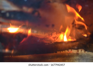 Ashes from a burning bonfire. - Shutterstock ID 1677942457