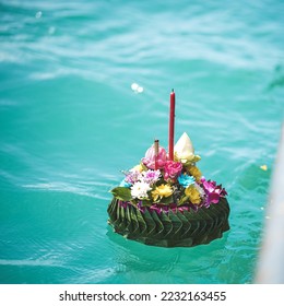Ashes floating ceremony. Floating a beautiful flowers Kratong for Scattering Ashes over the sea. Buddhism's Funeral Ceremony in Thailand. - Shutterstock ID 2232163455