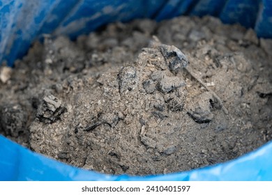 Ashes inside a trash can.