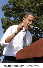 ASHEVILLE, NC - OCT. 5: Presidential Candidate Barack Obama Speaking At A Podium During A Campaign Rally At Asheville High School On October 5, 2008.