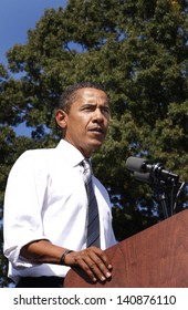 ASHEVILLE, NC - OCT. 5: Presidential Candidate Barack Obama Speaking At A Podium During A Campaign Rally At Asheville High School On October 5, 2008.