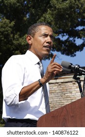 ASHEVILLE, NC - OCT. 5: Presidential Candidate Barack Obama Speaking At A Podium During A Campaign Rally At Asheville High School On October 5, 2008.