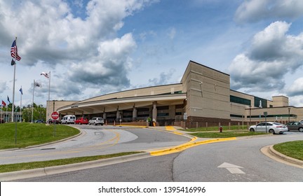 Asheville, NC / USA - May 11, 2019: This is a color image of the Charles George VA Medical Center in Asheville, North Carolina. This shows the Veterans Center with clouds and sky behind it.