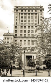 Asheville, NC / USA - May 11, 2019: Sepia toned photo of the Buncombe County courthouse in Asheville, NC on a beautiful spring day with blue skies and white clouds.