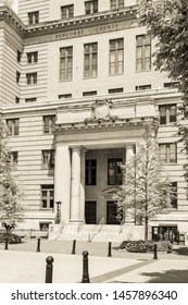 Asheville, NC / USA - May 11, 2019: Sepia toned  photo of the entrance to the Buncombe County courthouse in Asheville, NC on a beautiful spring day with blue skies and white clouds.