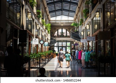 ASHEVILLE, NC, USA-10 JUNE 2018: A hallway inside the Grove Arcade, featuring a variety of small shops.