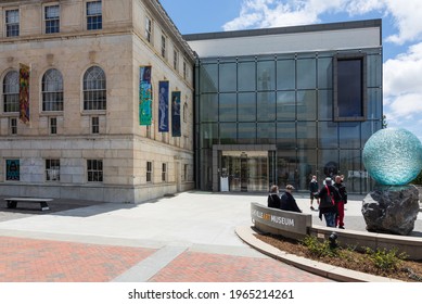 ASHEVILLE, NC, USA-25 APRIL 2021: 6 People Outside The Asheville Ar Museum, Beside The Large Blue Ball Artwork.