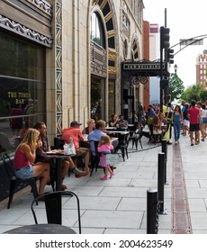 ASHEVILLE, NC, USA-27 JUNE 2021: The Iconic S And W Building, Including The Times Bar, With Busy Sidewalk Seated Patrons. Diagonal Perspective.