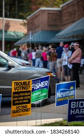 Asheville, North Carolina - 15 October 2020: A Sign Asking About Voting Trouble Beside The Long Lines Into Early Voting In North Carolina