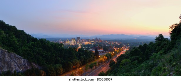 Asheville, North Carolina skyline nestled in the Blue Ridge Mountains.