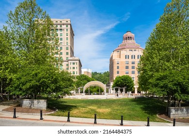 Asheville, North Carolina USA - May 5, 2022: Cityscape view of the municipal buildings in the downtown district of this popular small town visitor destination in the Blue Ridge mountains.