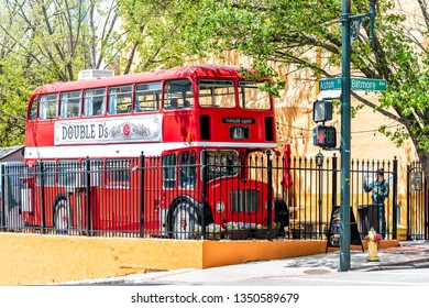 Asheville, USA - April 19, 2018: People double decker d's bus cafe restaurant outside on a street serving coffee drinks and desserts in North Carolina city