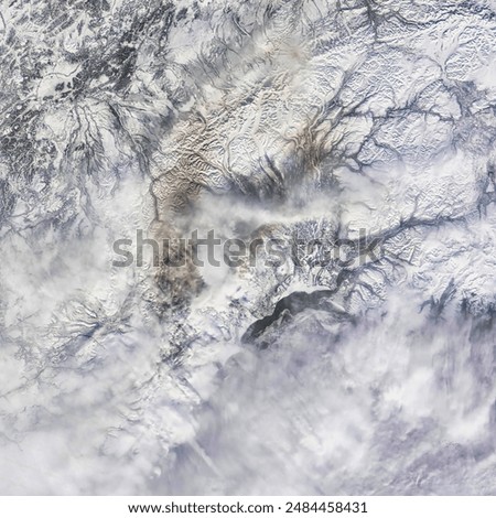 Ashfall from Redoubt Volcano. Mount Redoubt sent a column of ash some 19 kilometers skyward. On March 23, 2009, ash was visible on the snowy lan Elements of this image furnished by NASA.