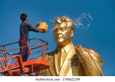 Ashgabat, Turkmenistan - 9/23/2017: Cleaning Of One Of The Famous Golden Statues Of President Turkmenbashi