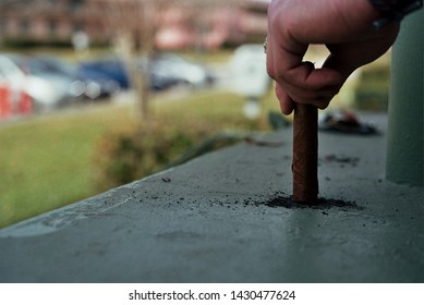 Ashing Out The Cigar Outside