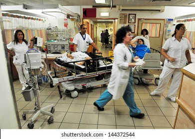 ASHKELON, ISR - AUG 22 2010:Medical staff on duty in Barzilai medical center emergency department.The emergency departments of most hospitals in the world operate 24 hours a day.